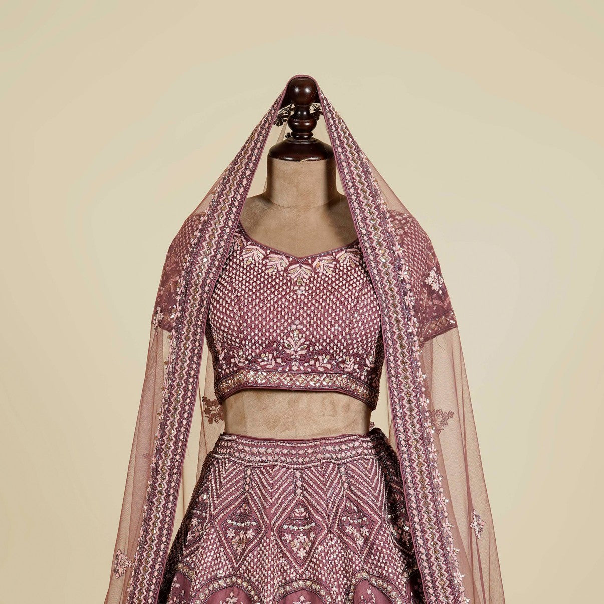 Onion color Lehenga Choli embellished with Zardosi, Dabka and Mukaish work