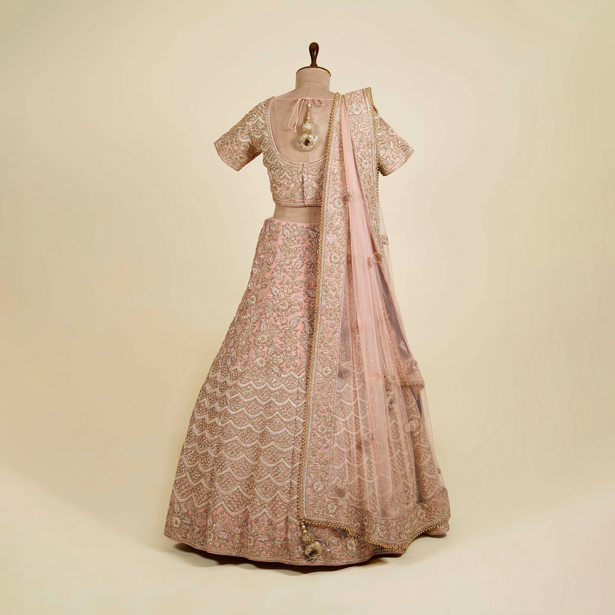Pink Lehenga Choli embellished with Zardosi, Stone and Knot work