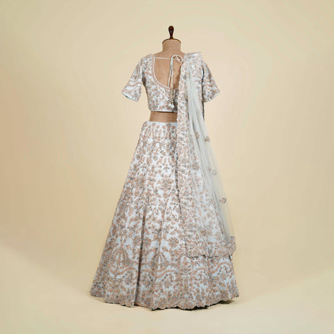 Sky Blue Lehenga Choli embellished with Zardosi, Thread and Knot work