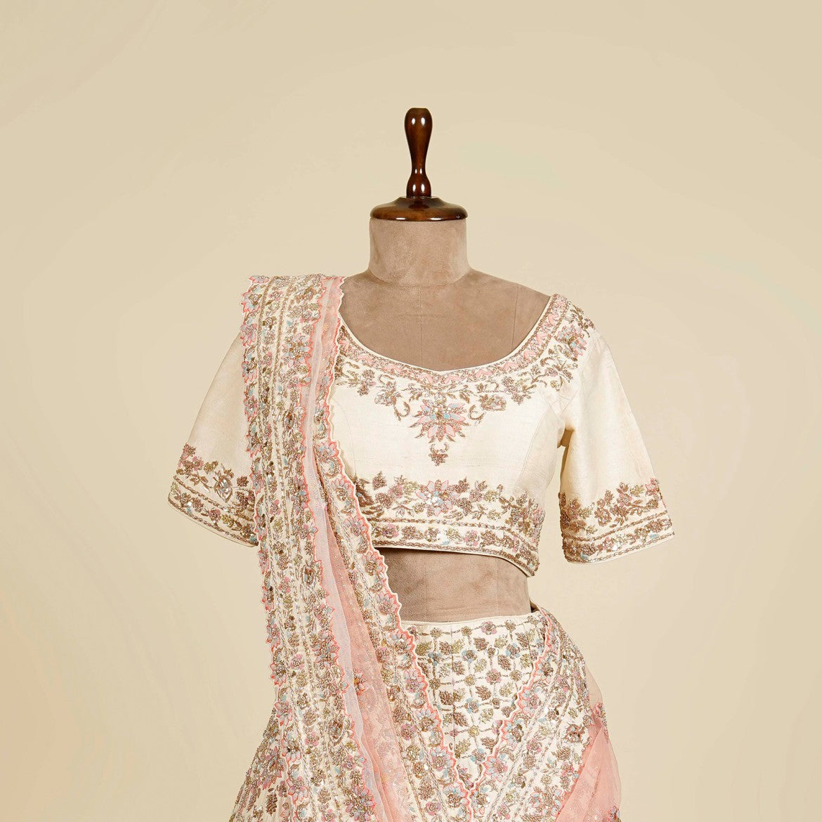 Ombre Cream-Peach Lehenga Choli embellished with Zardosi, Thread and Mukaish work