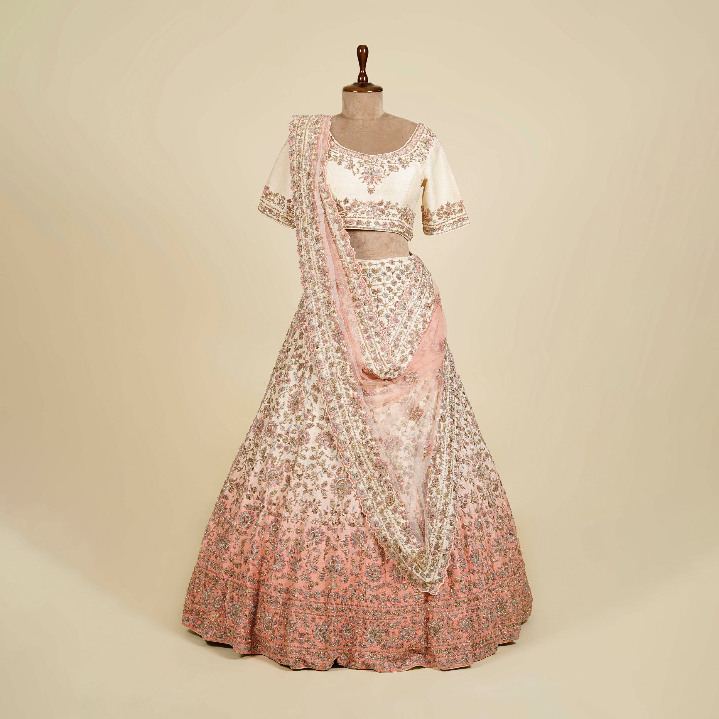 Ombre Cream-Peach Lehenga Choli embellished with Zardosi, Thread and Mukaish work