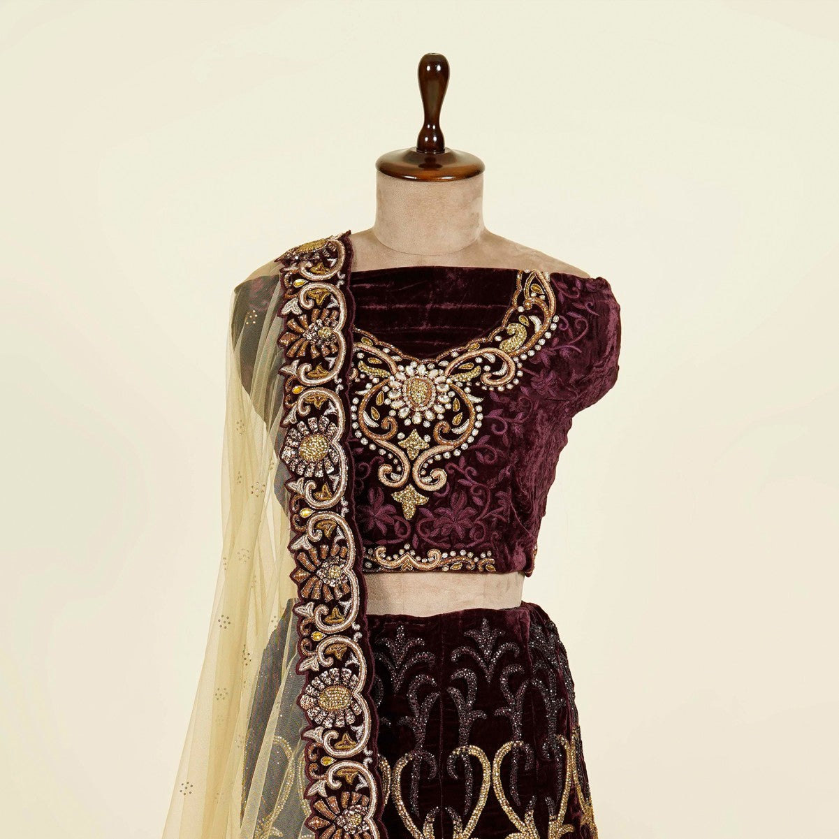 Wine Lehenga Choli embellished with Swarovski and Thread work