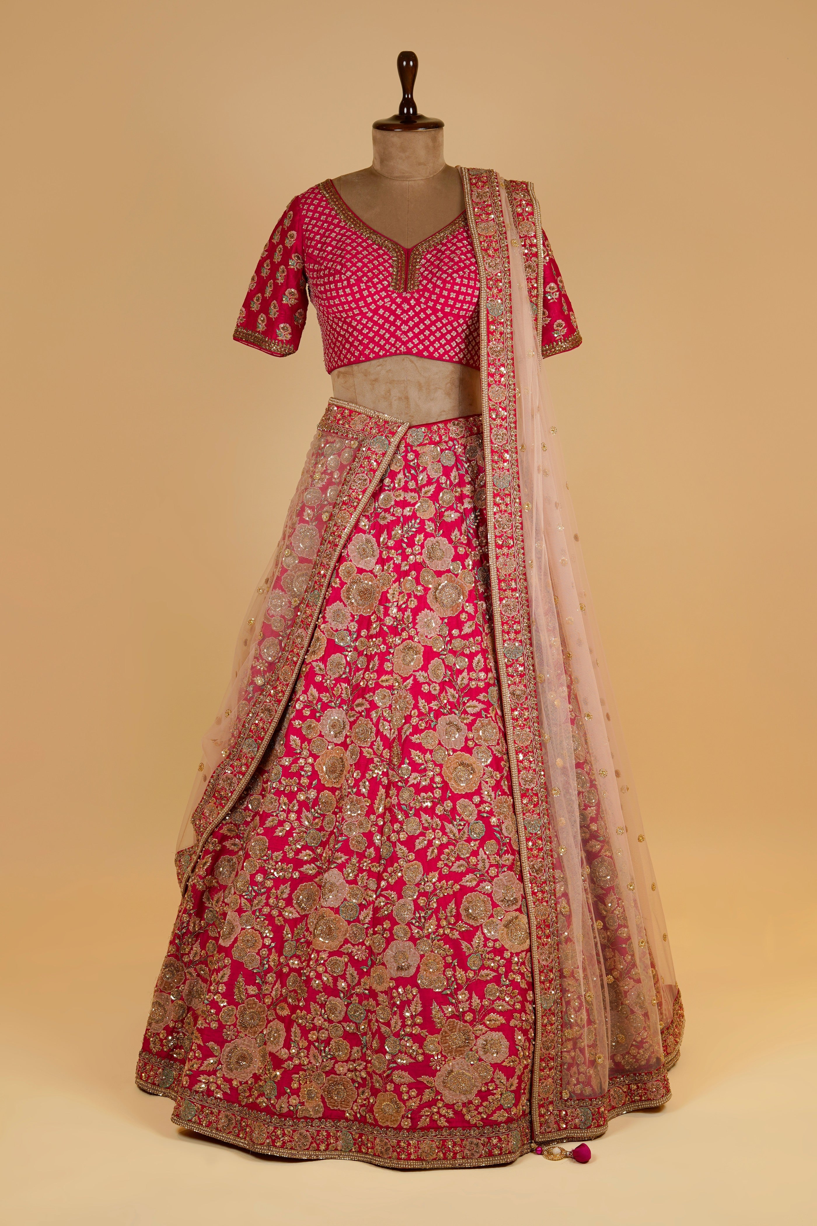 Rani Pink Lehenga adorned with Million Flowers on the Skirt