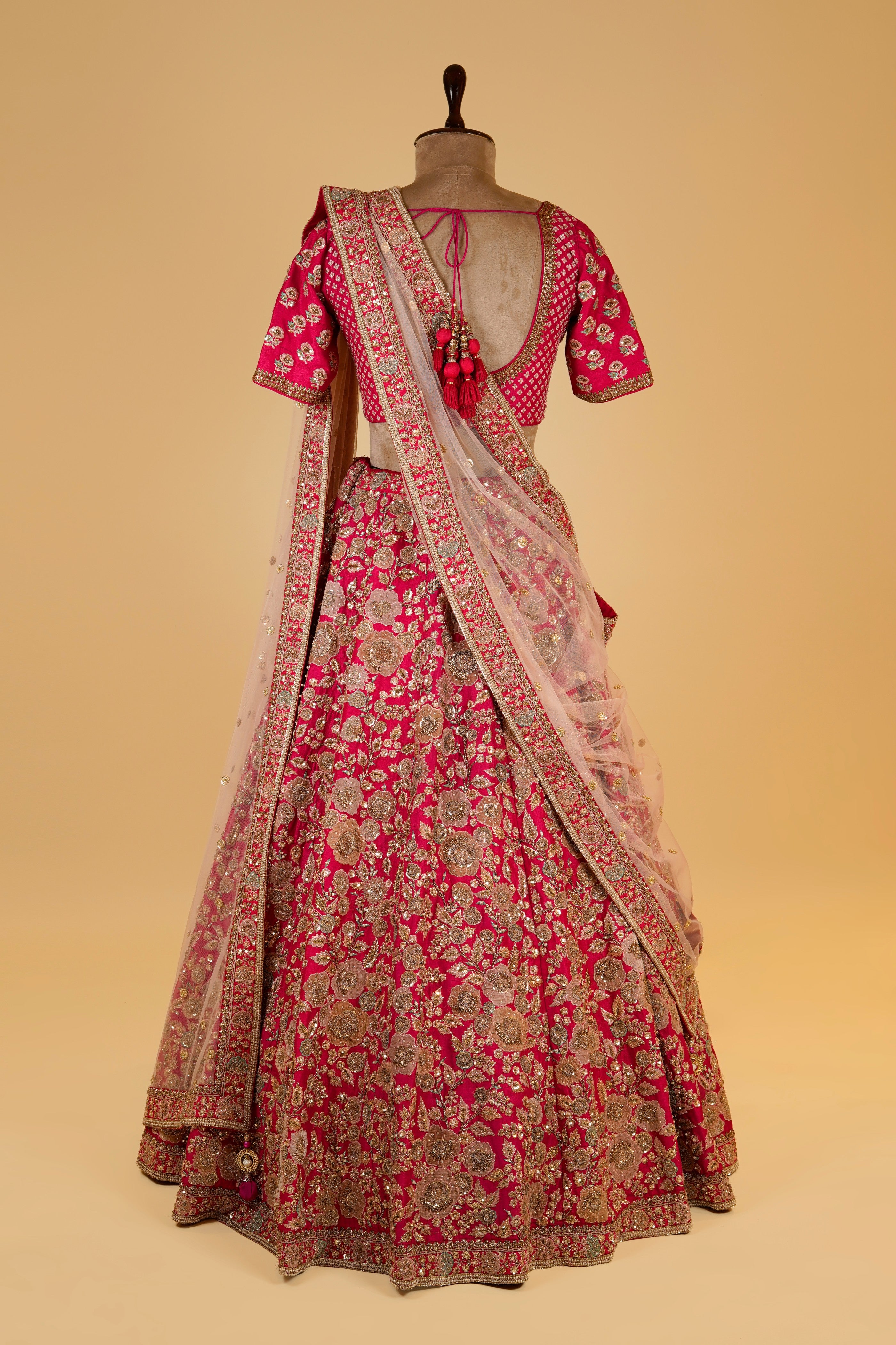 Rani Pink Lehenga adorned with Million Flowers on the Skirt